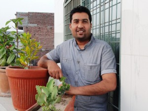 Nadeem tends to a few of his forty garden plants.