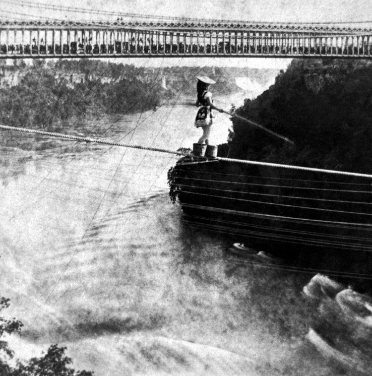 This picture represents what we wish we could explain but can't.  Photo from: http://en.wikipedia.org/wiki/File:Maria_Spelterini_at_Suspension_Bridge.jpg