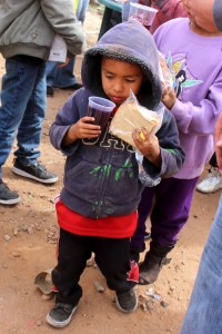 A little one receiving food at the Tijuana Dump.