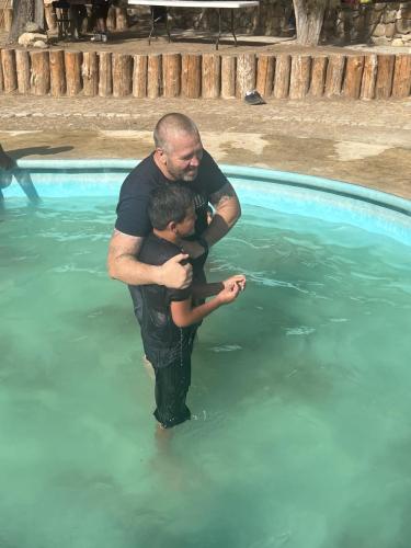 Jon had the honor of baptizing our great friends' son during the 5th anniversary celebration.